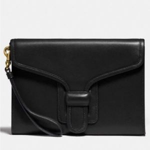 Coach Courier Wristlet in black. Never used.